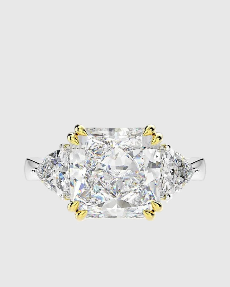 Top-down view of the 4-carat brilliant lab-grown diamond ring, showcasing the flawless symmetry of the princess-cut center stone and the contrasting yellow gold prongs.
