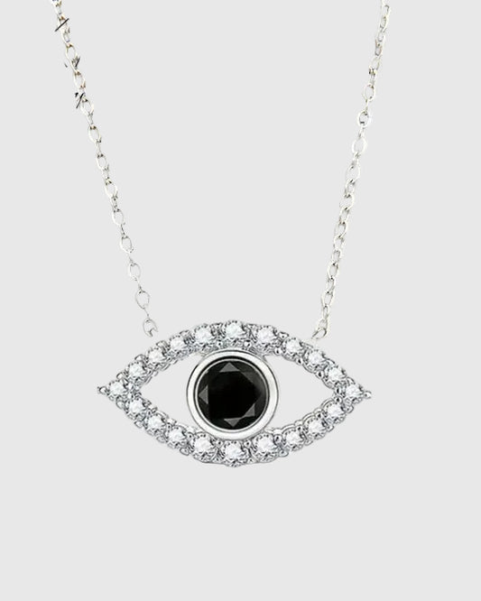 Full studio view of the Auréveil Oculus 925 sterling silver necklace, highlighting the brilliant 1-carat black moissanite center stone framed by a zircon pave halo in an evil eye motif.