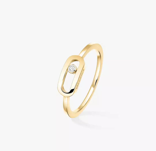 Gold Move Uno ring with a diamond on a white background