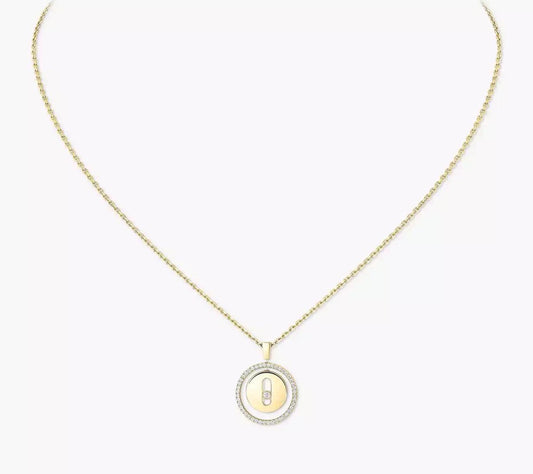 Gold necklace with a round pendant on a white background