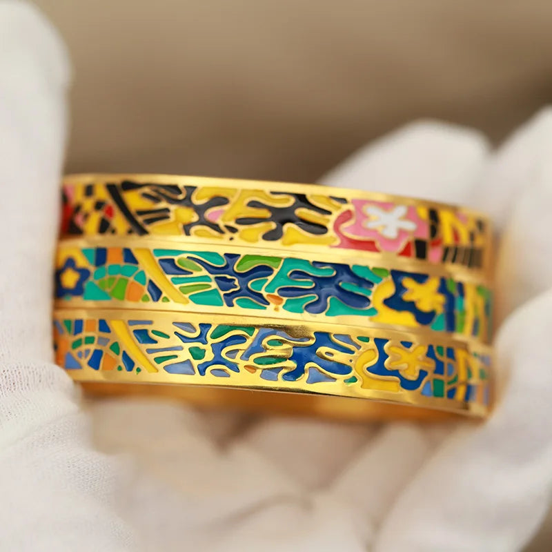 Colorful patterned bangles on a white glove