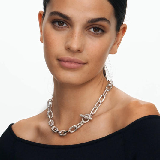 Woman wearing a Sterling Silver chain necklace with Diamonds, 11mm on a white background