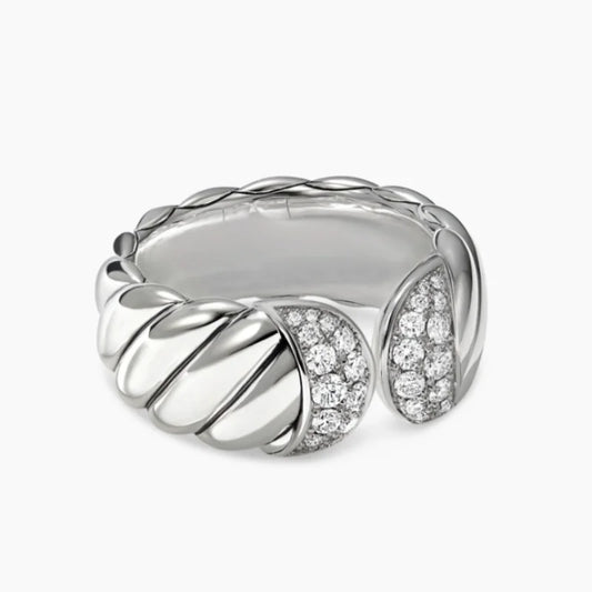 Silver ring with diamond accents on a white background