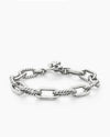 Angled view of the Claspéra Madison rhodium-plated sterling silver bracelet, demonstrating the heavy, substantial feel of the 11mm architectural links.