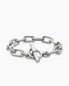 Angled view of the Claspéra Madison rhodium-plated sterling silver bracelet, demonstrating the heavy, substantial feel of the 11mm architectural links.