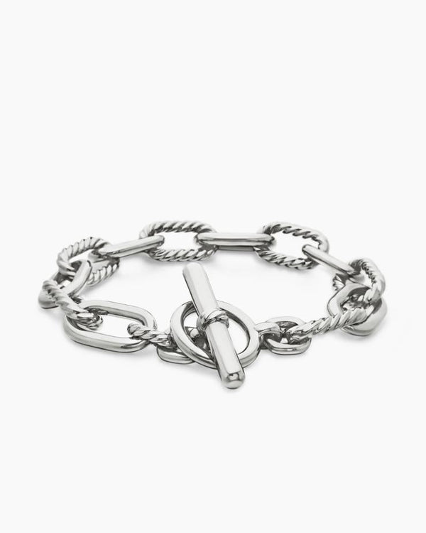 Angled view of the Claspéra Madison rhodium-plated sterling silver bracelet, demonstrating the heavy, substantial feel of the 11mm architectural links.