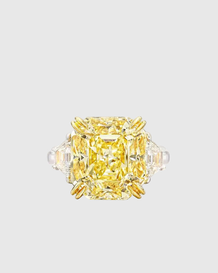 Top-down view of the dazzling 13x13mm yellow crushed ice high-carbon zircon set in 18K yellow gold prongs to maximize its vibrant golden hue.