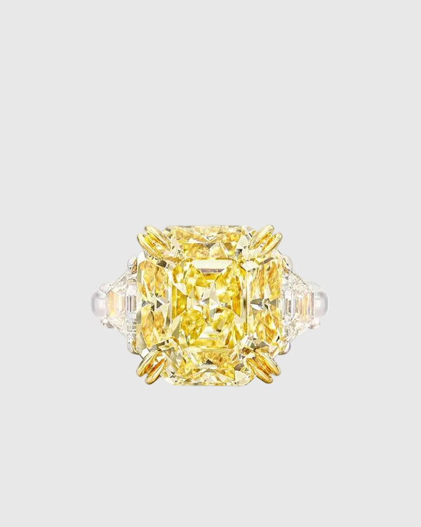 Top-down view of the dazzling 13x13mm yellow crushed ice high-carbon zircon set in 18K yellow gold prongs to maximize its vibrant golden hue.