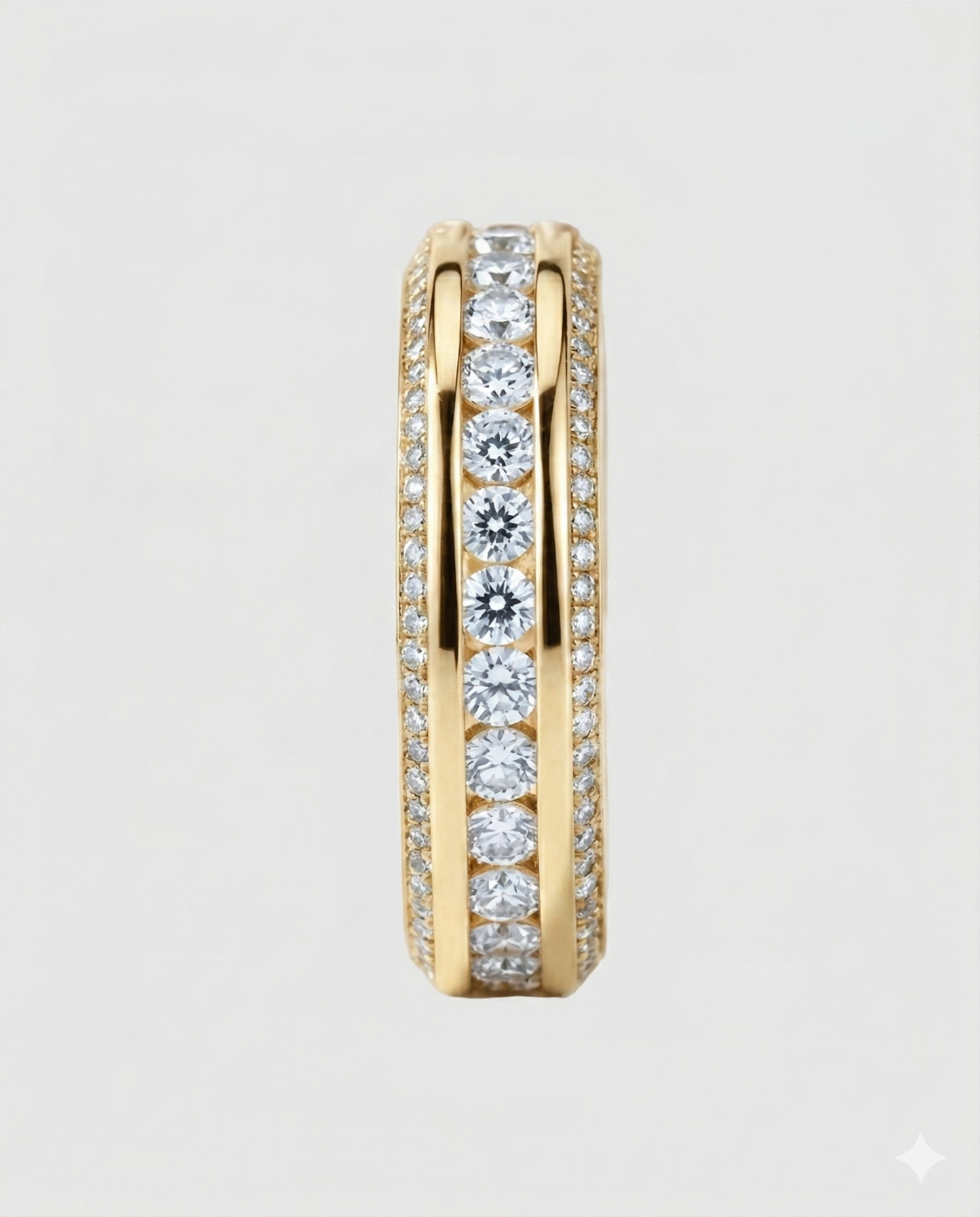 Full studio shot of the 18K yellow gold-plated Éternara eternity band, highlighting the intricate three-row design with a framed center and micro-pavé edges.