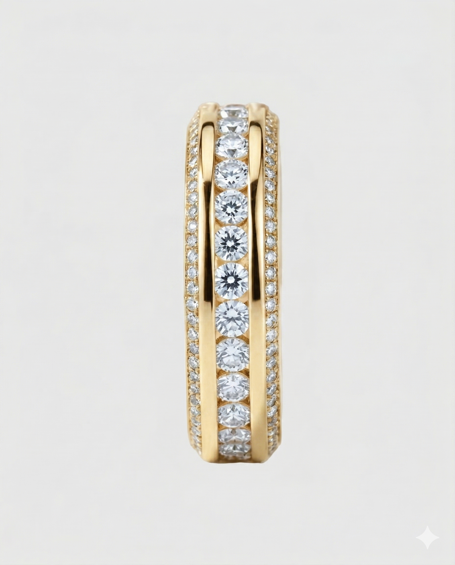 Full studio shot of the 18K yellow gold-plated Éternara eternity band, highlighting the intricate three-row design with a framed center and micro-pavé edges.