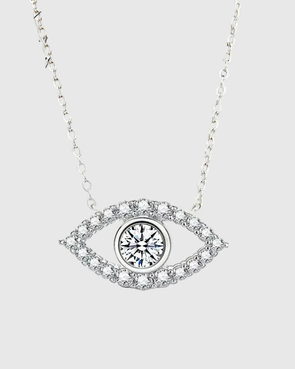 Full studio view of the Auréveil Oculus 925 sterling silver necklace, highlighting the brilliant 1-carat white moissanite center stone framed by a zircon pave halo in an evil eye motif.