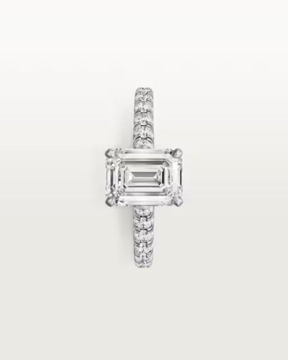 Top-down view of the stunning 8x10mm D-color VVS1 moissanite center stone, demonstrating the perfect symmetry and icy white brilliance of the engagement ring.