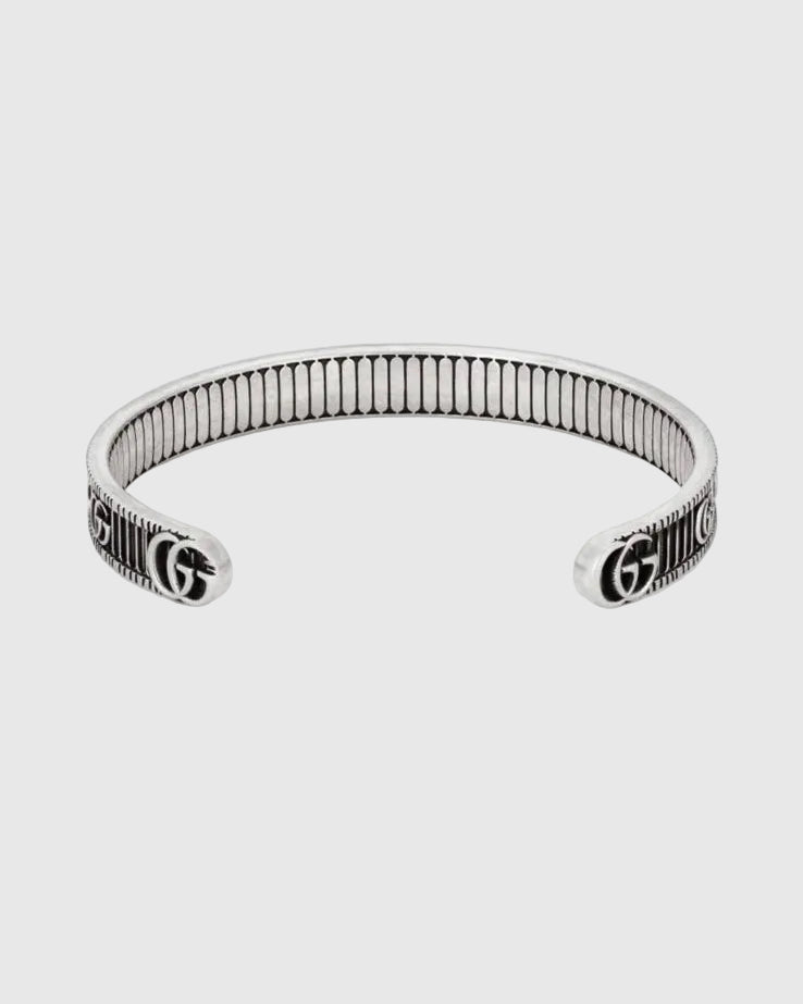 Silver bracelet with Gucci logo on a website page