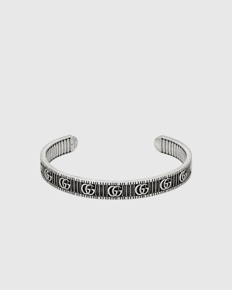 Textured luxury silver bangle cuff with engraved monogram design, minimalist yet bold statement bracelet for women
