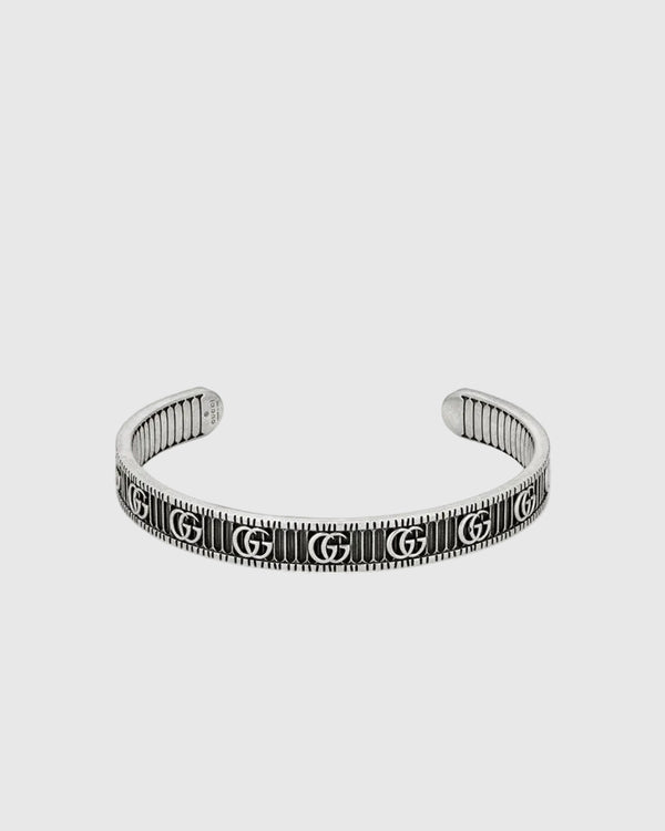 Textured luxury silver bangle cuff with engraved monogram design, minimalist yet bold statement bracelet for women