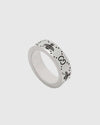 Silver ring with bee design on a white background.
