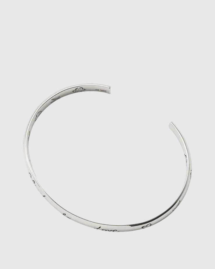 Silver bracelet on a white background.