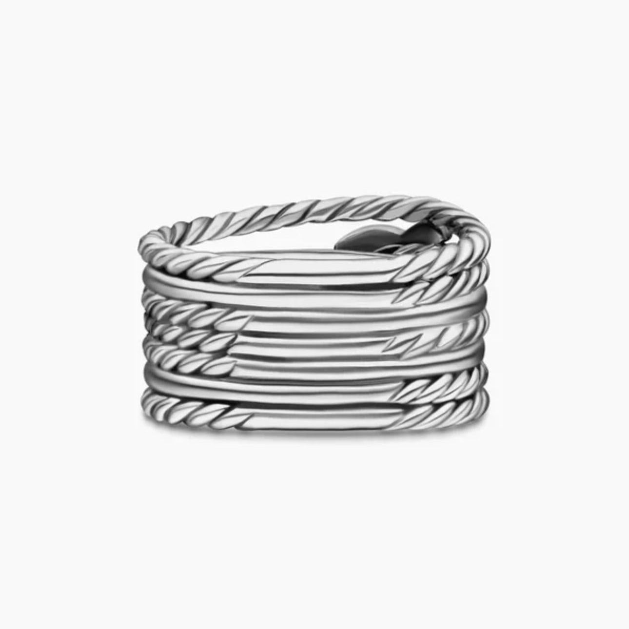 Silver ring with twisted design on a white background