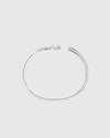 Top-down view of the L’Éthérée bracelet showing its circular claspless design and fully articulated structure that wraps the wrist.