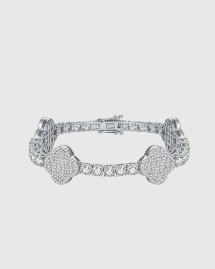 Full studio view of the Aerion Trèfle rhodium-plated sterling silver tennis bracelet, highlighting the seamless integration of 4mm round-cut moissanites and micromosaic pavé clovers.