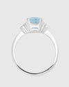  Front face view of the natural blue topaz ring highlighting the flawless aristocratic emerald cut and the sparkling 1.36 carats of side lab-grown diamonds.