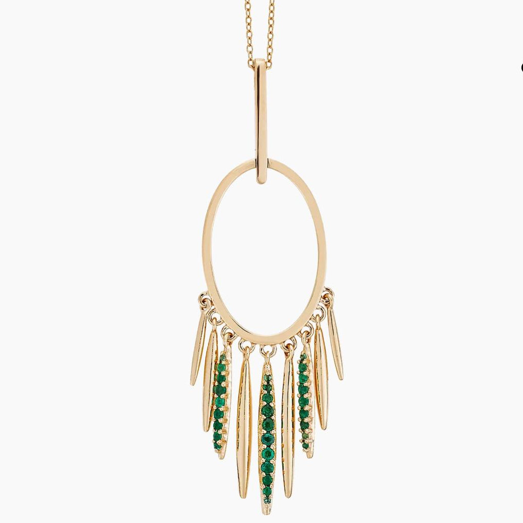 Gold necklace with green gemstone pendants on a white background