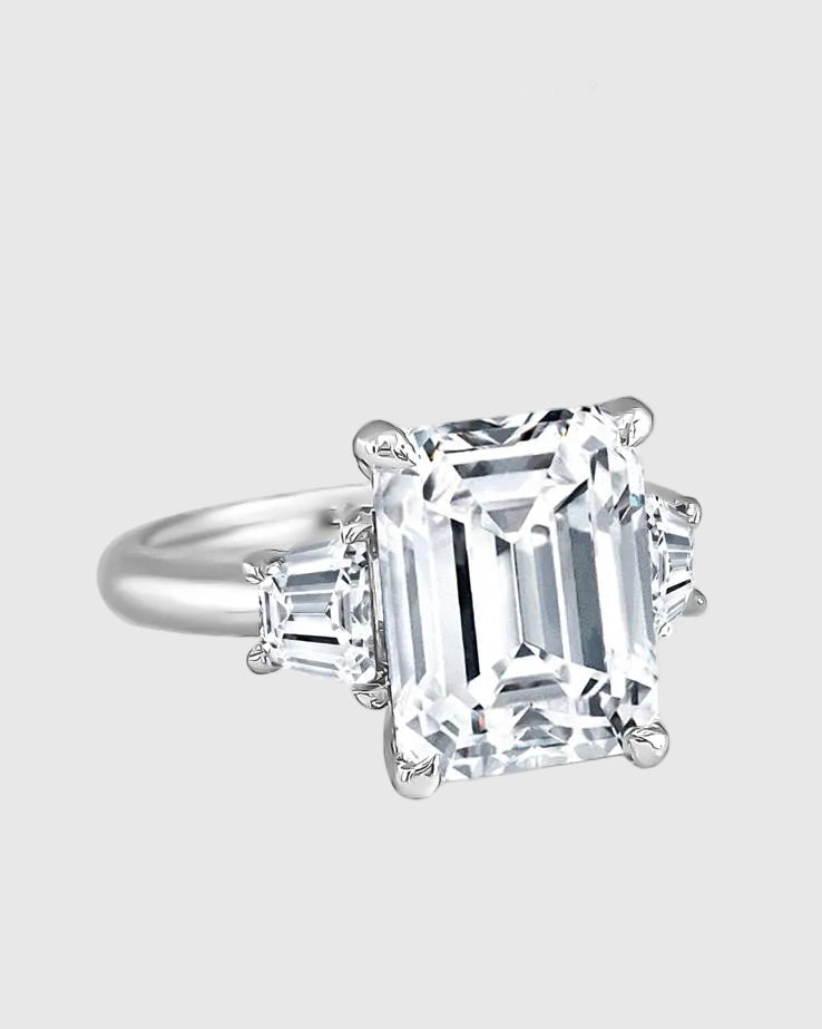 Side profile of the aristocratic engagement ring showing the secure four-prong basket setting holding the 9x11mm D-color VVS1 moissanite center stone.