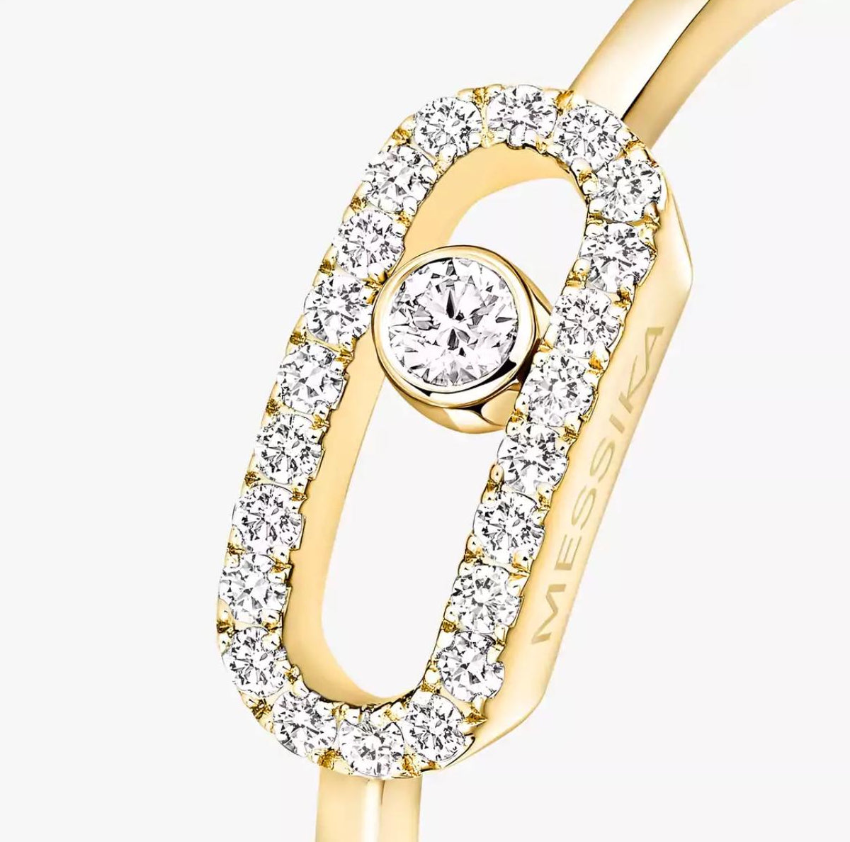 Gold Move Uno ring with a diamond on a white background