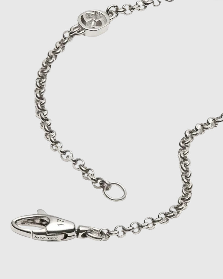Aerion Cuore 925 sterling silver chain bracelet featuring interlocking monogram charms and an ornately engraved vintage heart pendant.
