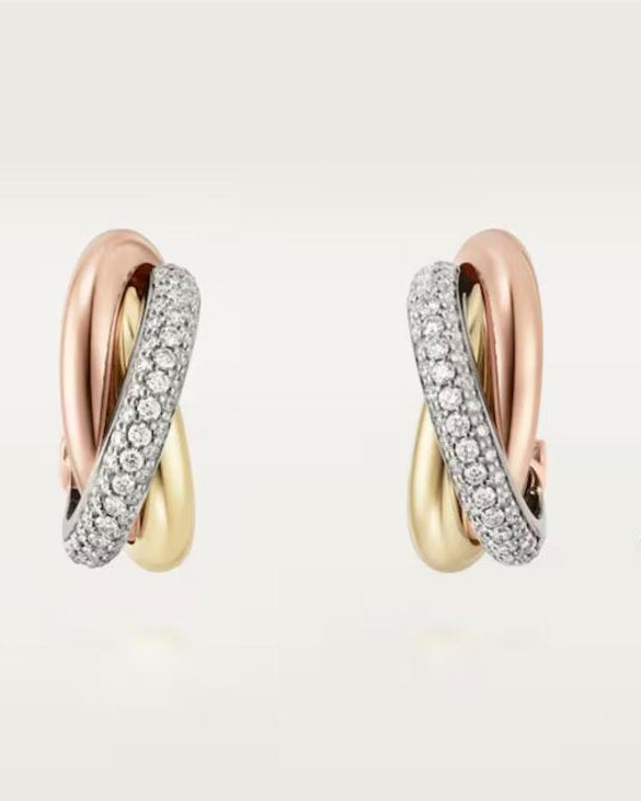 Front view of the half-paved tri-color earrings, showcasing one ring entirely encrusted with 142 D-color VVS1 micro-pavé moissanite stones.