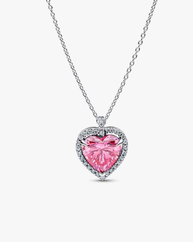 Front studio shot of the 1CT pink heart-cut moissanite pendant with a radiant halo in silver.