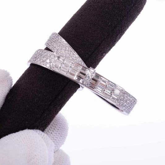 Silver ring with diamond on a black napkin against a white background