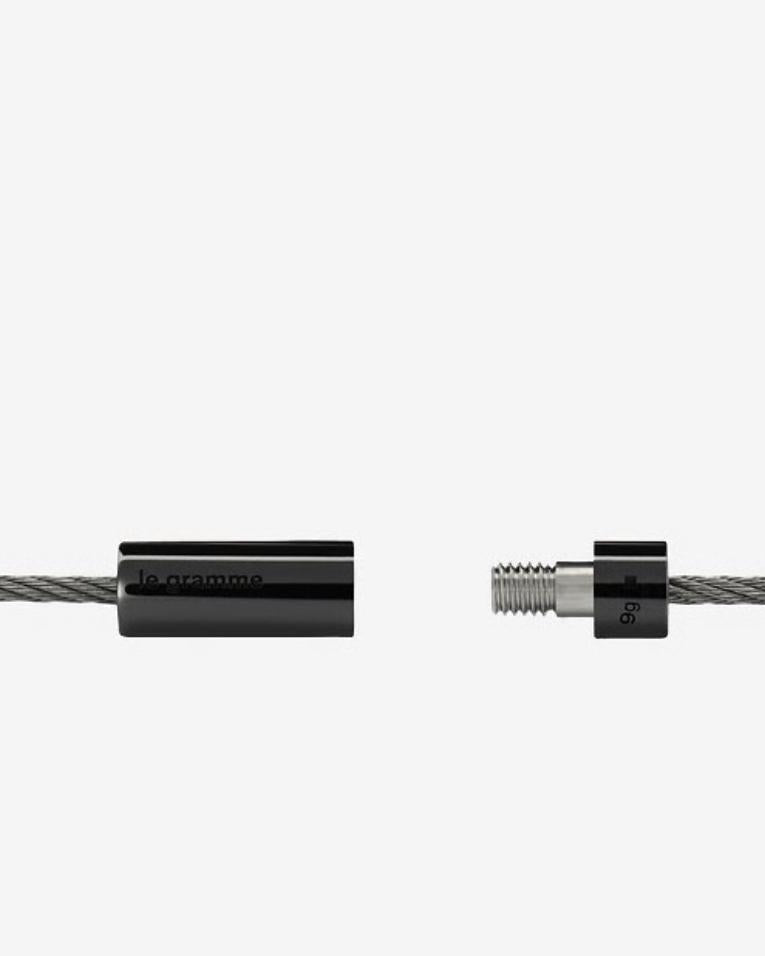 Close-up of two black cable connectors on a white background