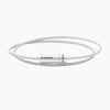 Silver cable bracelet with a cylindrical tag on a white background