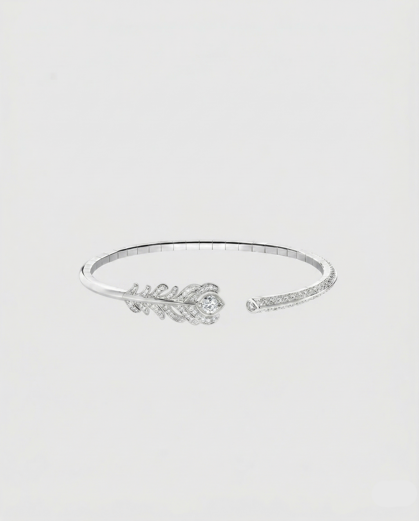 Front view of the peacock feather head of the L’Éthérée bracelet, featuring 117 pavé-set VVS1 diamonds on white gold plated silver.
