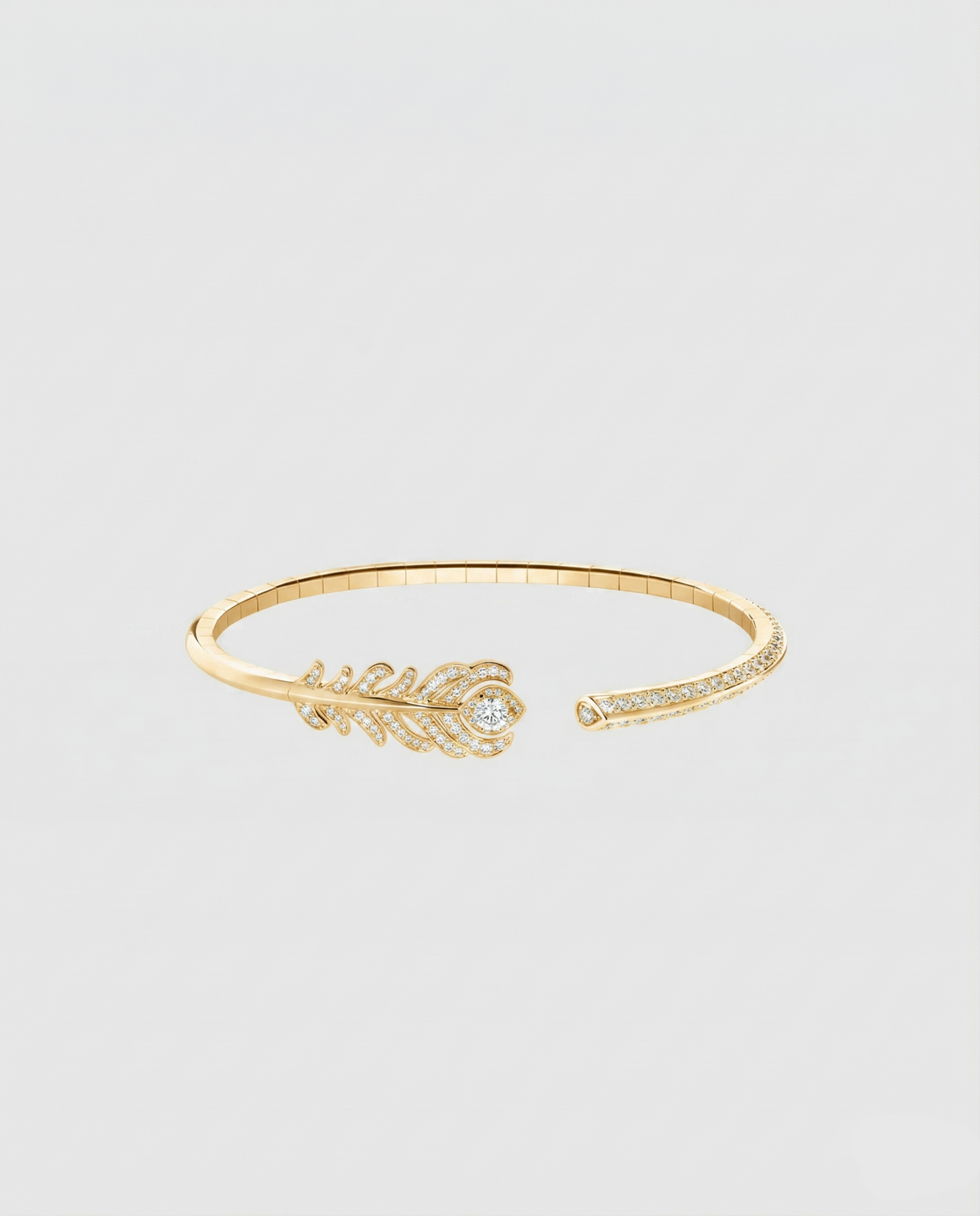 Front view of the peacock feather head of the L’Éthérée bracelet, featuring 117 pavé-set VVS1 diamonds on gold plated silver.