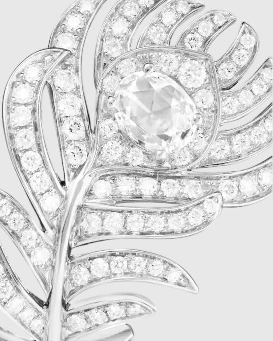 Close-up of the peacock feather head of the L’Éthérée ring, featuring 84 pavé-set VVS1 diamonds on white gold plated silver.
