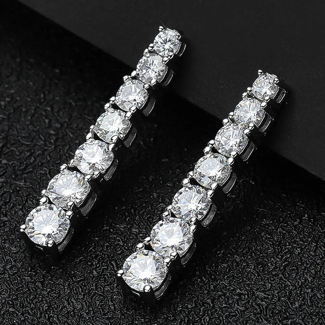 Lumora Radiance moissanite earrings — 925 silver, 18K white gold plating, D color VVS1 stones on black background