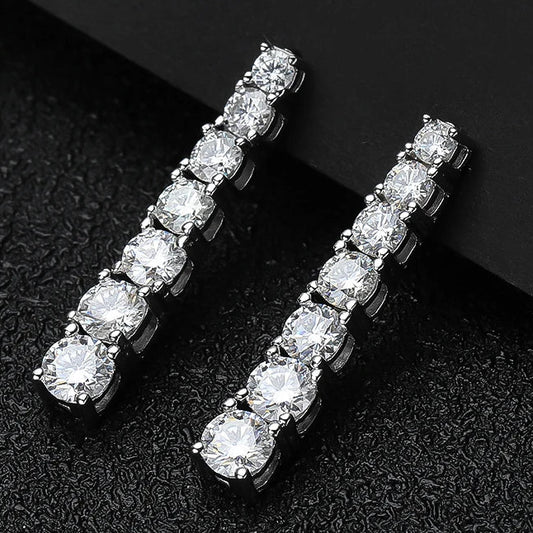 Lumora Radiance moissanite earrings — 925 silver, 18K white gold plating, D color VVS1 stones on black background