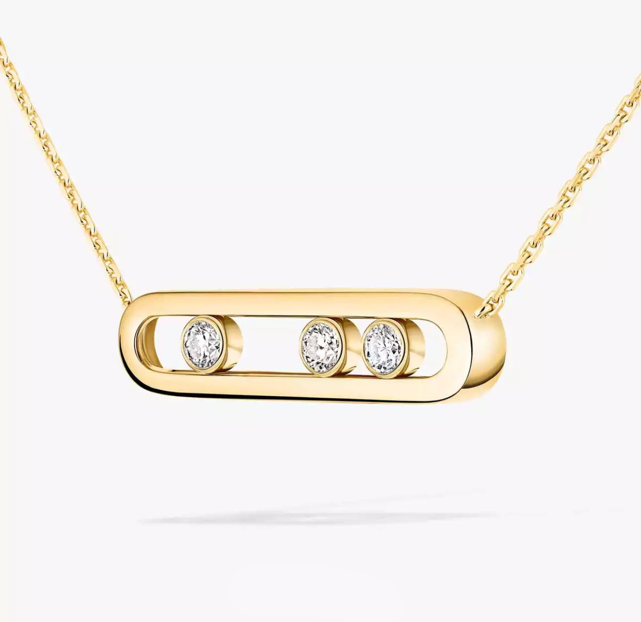 Gold necklace with three diamond-like stones on a white background