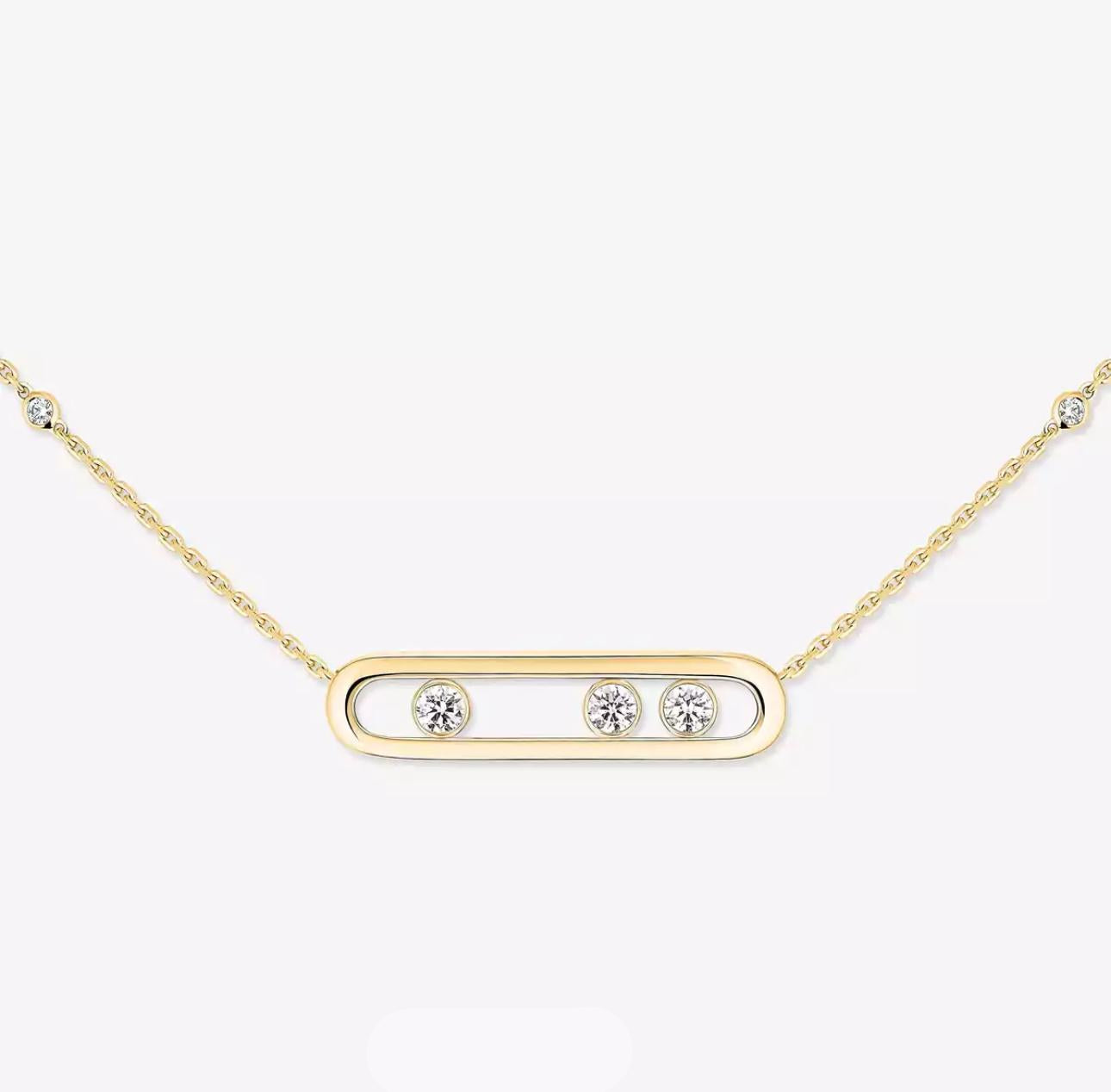 Gold necklace with three diamonds on a white background