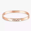 Rose gold diamond bangle bracelet with small diamonds on a white background.