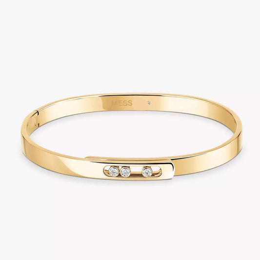 gold diamond bangle bracelet with small diamonds on a white background.