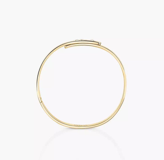 Gold diamond bangle bracelet on a white background