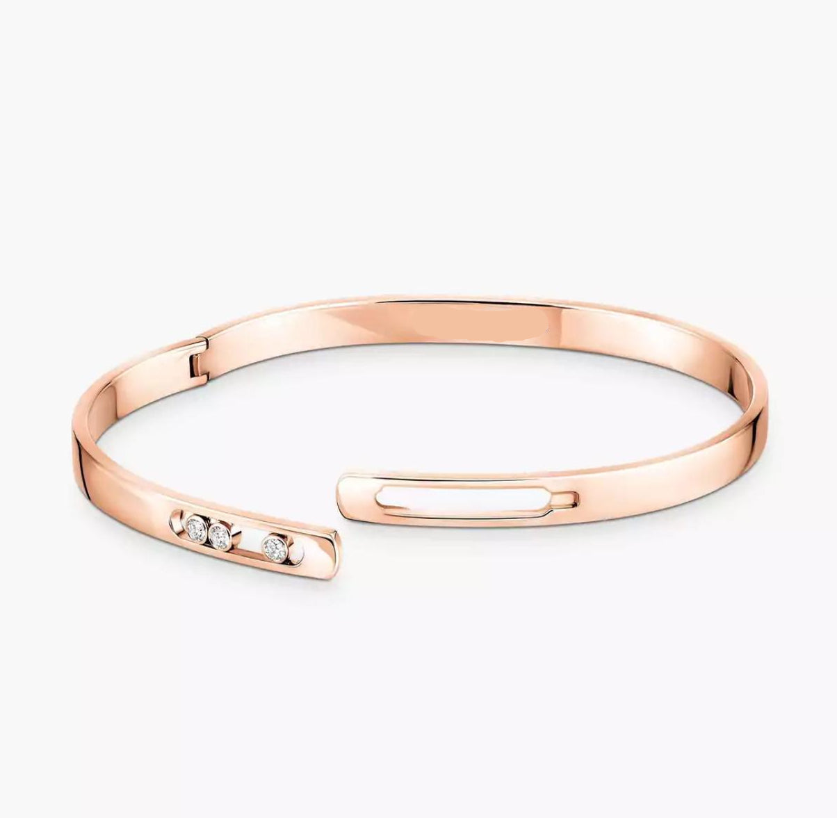 Rose gold diamond bangle bracelet with small diamonds on a white background.
