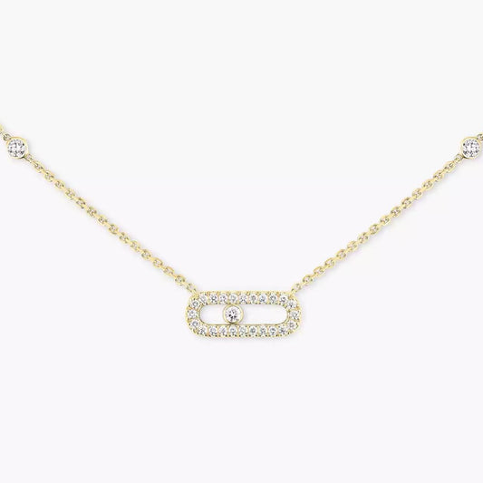 Gold necklace with a small rectangular pendant on a white background