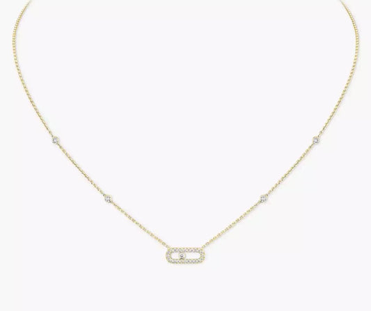 Gold necklace with a small pendant on a white background