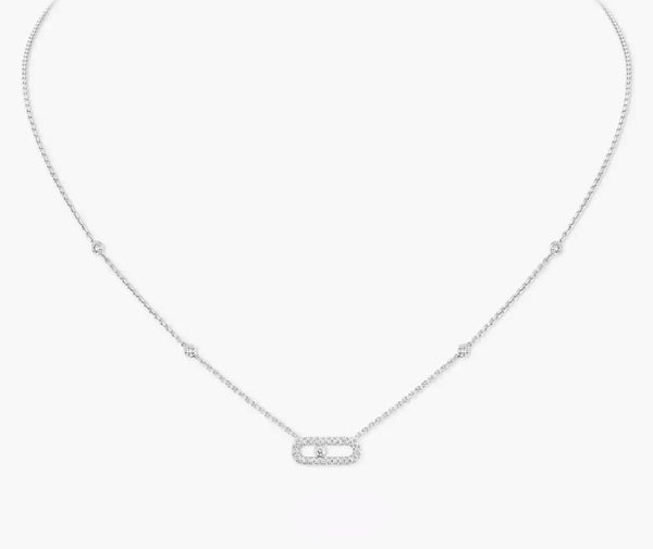 Silver necklace with a small pendant on a white background