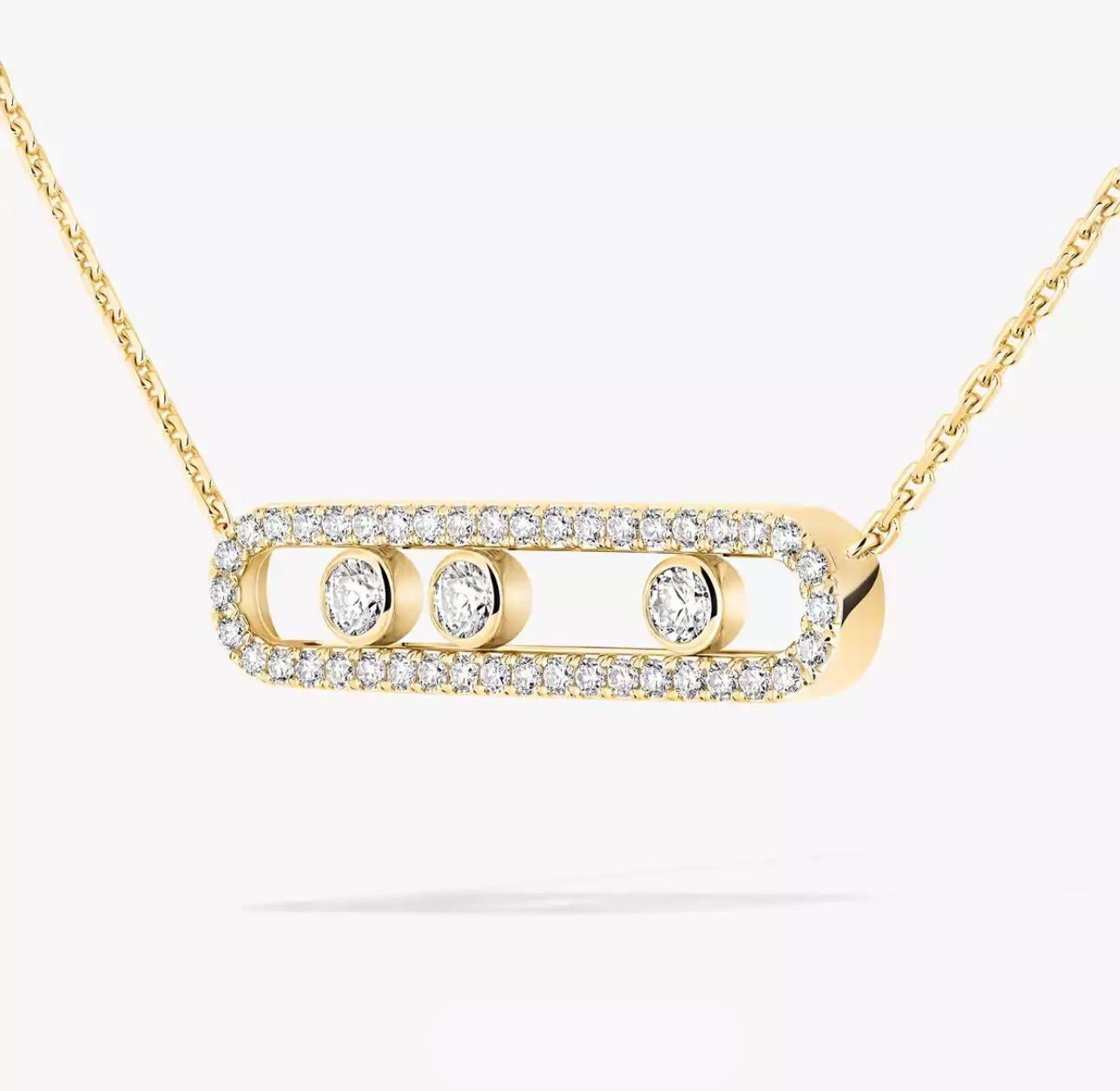 Gold necklace with diamond pendant on a white background