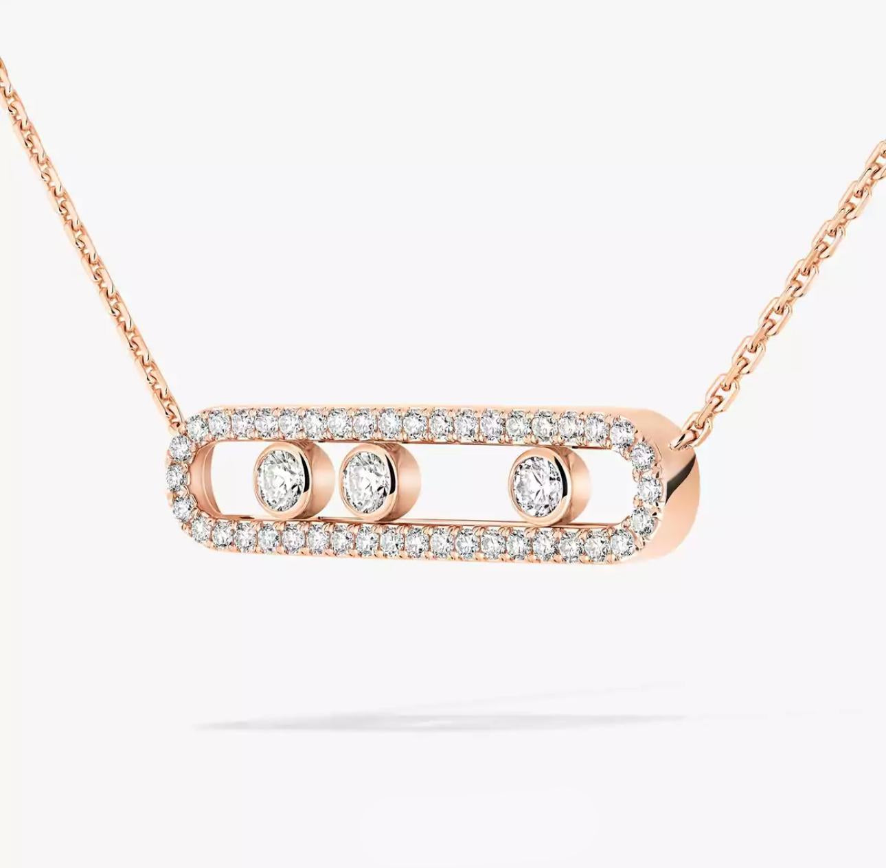 Rose gold necklace with diamond accents on a white background